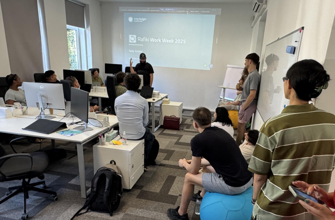 Members of the Rafiki team collaborating during a work session at the July 2025 work week.