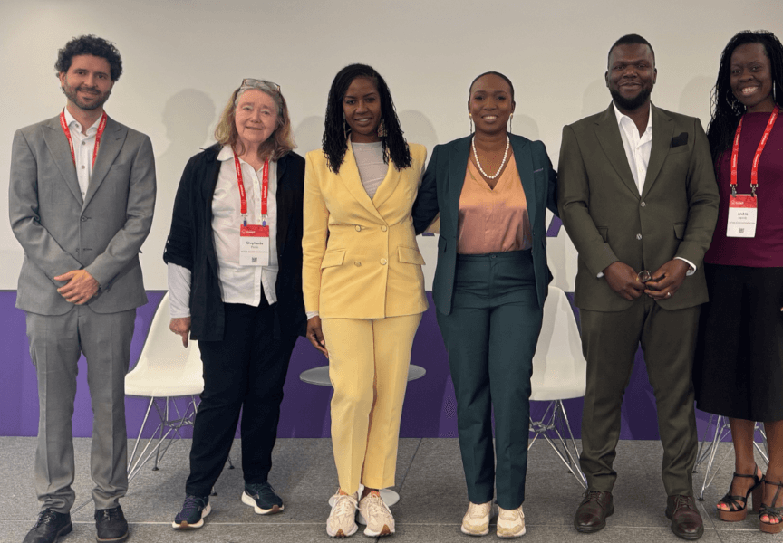 A group photo of participants who took part in a panel discussion convened by the Interledger Foundation at the 2025 Payments Canada Summit. The group stands together, smiling, in front of a summit-branded backdrop.
