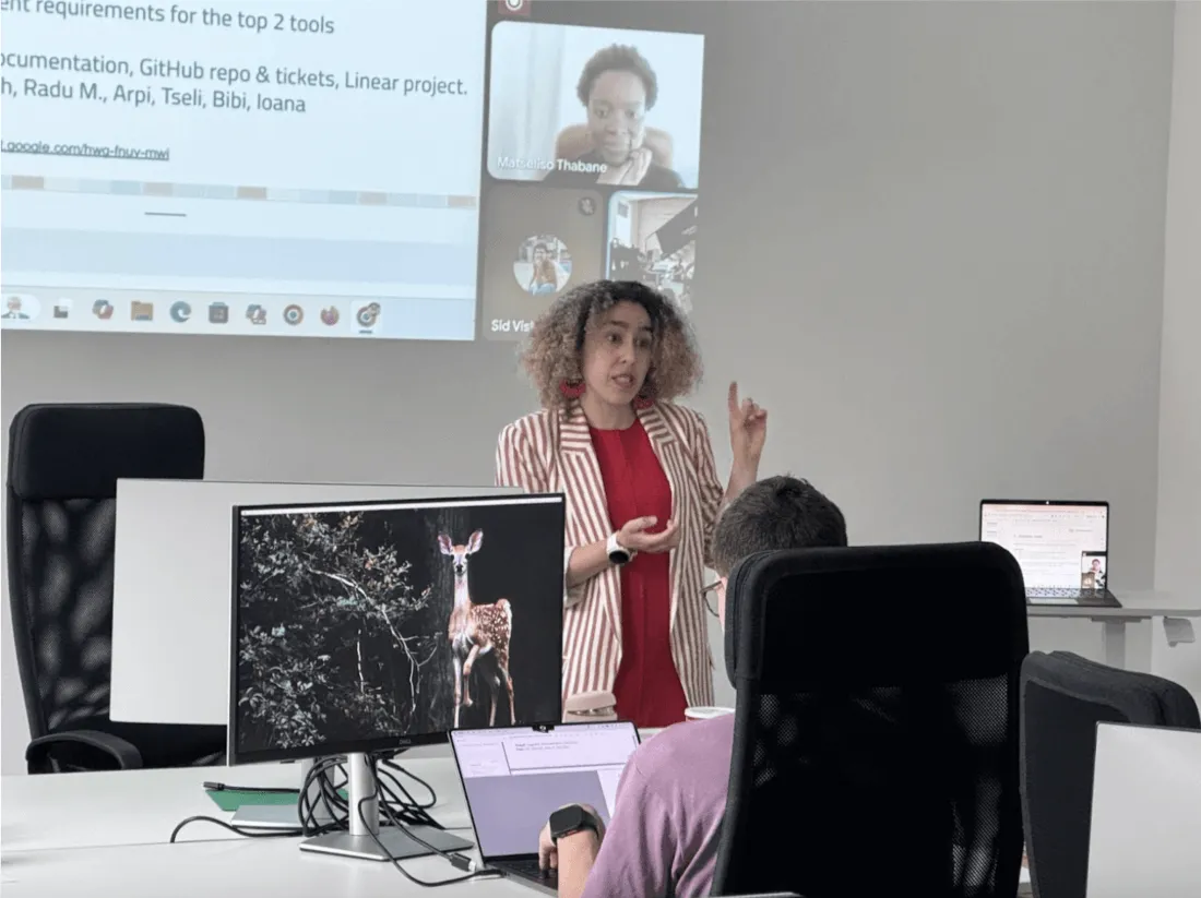 On site and online members of the Web Monetization team collaborating during a work session at the May 2025 work week.