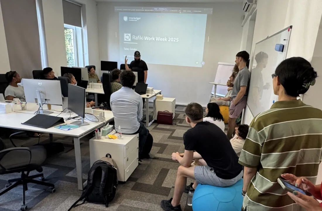 Members of the Rafiki team collaborating during a work session at the July 2025 work week.