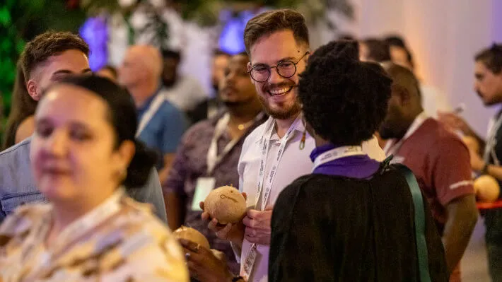 People interacting at the Summit dinner